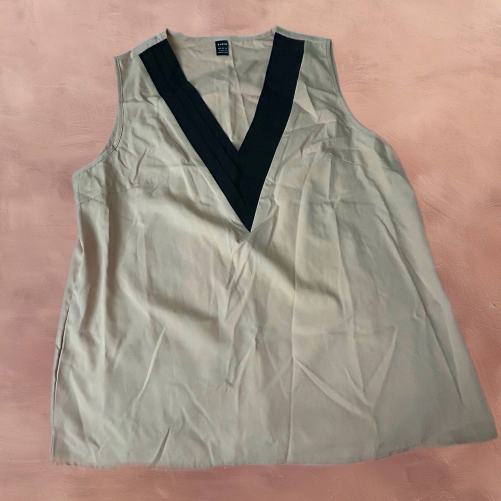 Sleeveless blouse deep v-neck